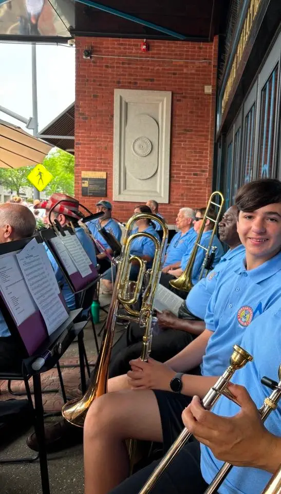 Galileo Solis with his trombone at the American Airpower Museum Concert Band, Patchogue Parade