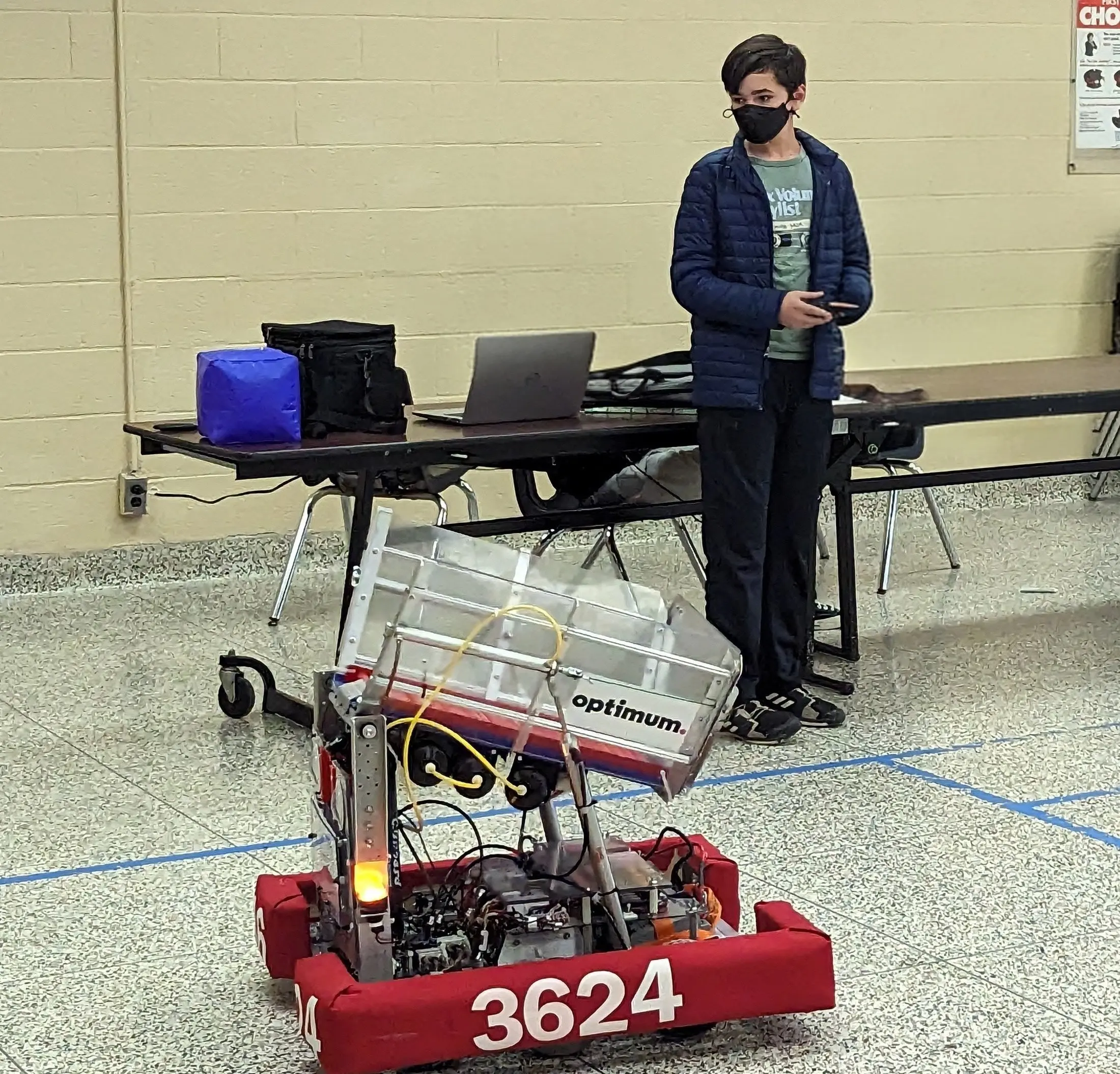 Galileo Solis driving the robot at a FIRST Robotics Competition event