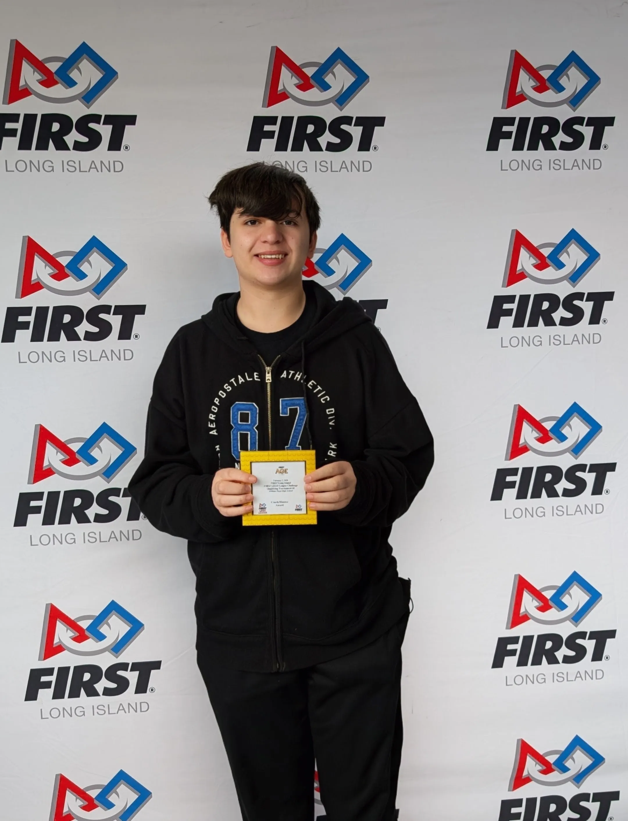 Galileo Solis receiving the FIRST LEGO League Coach Mentor Award