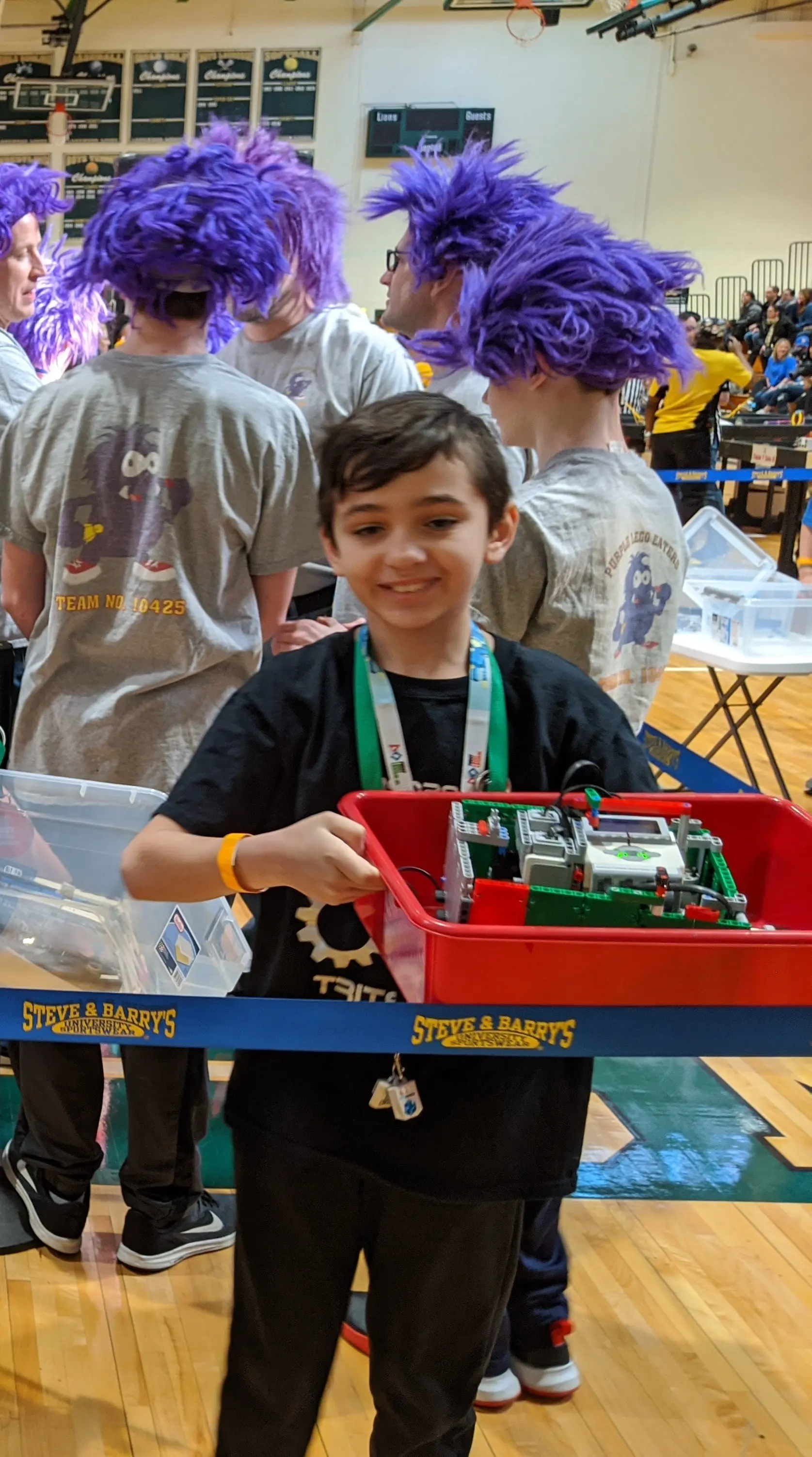 Galileo Solis with his team robot at a FIRST LEGO League competition