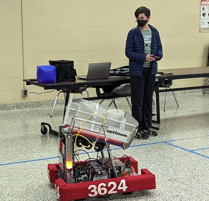 Galileo Solis driving the robot at a FIRST Robotics Competition event